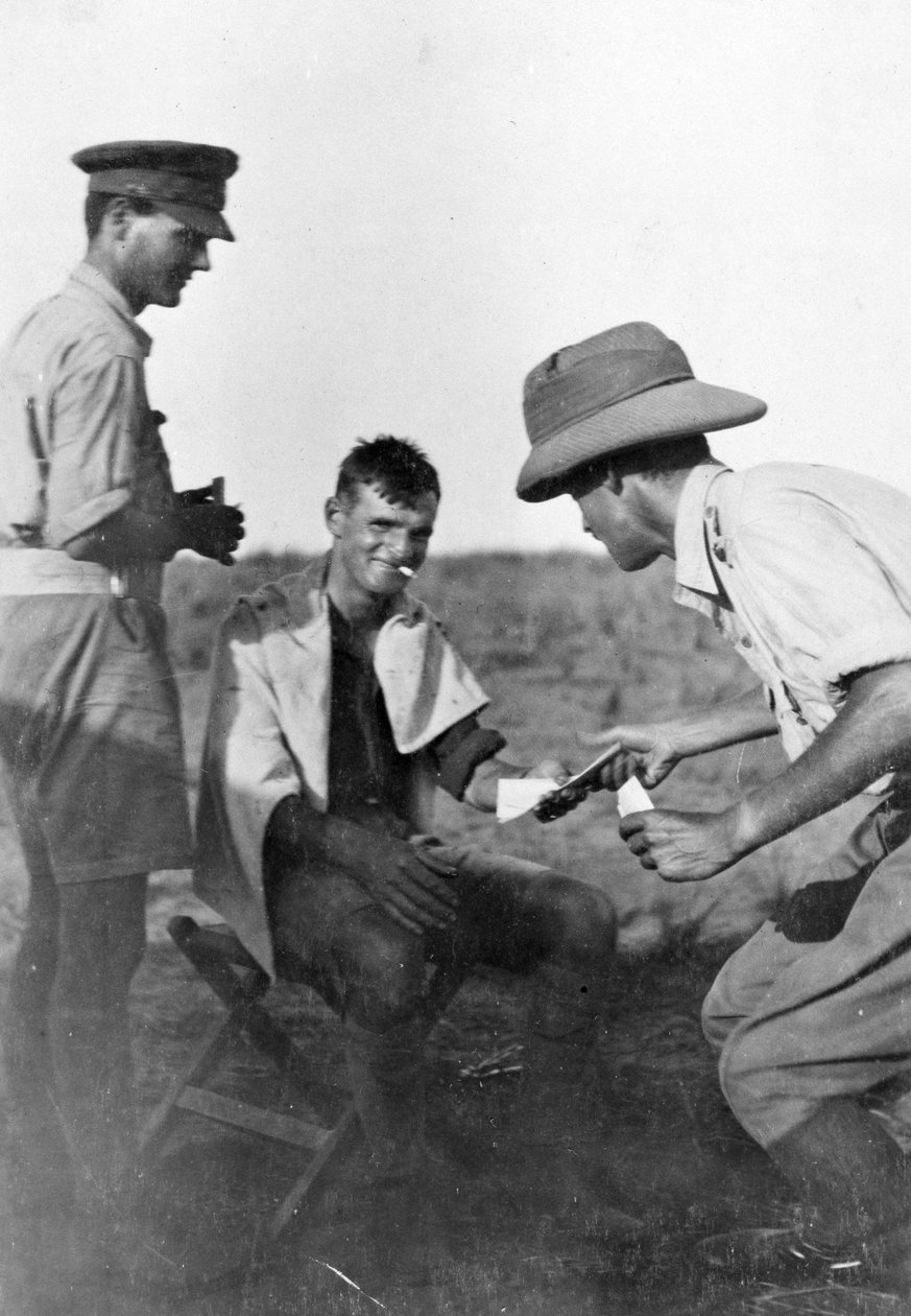 A soldier being given mail in Mesopotamia during World War One, from an album compiled by Lt. Kindom by English Photographer