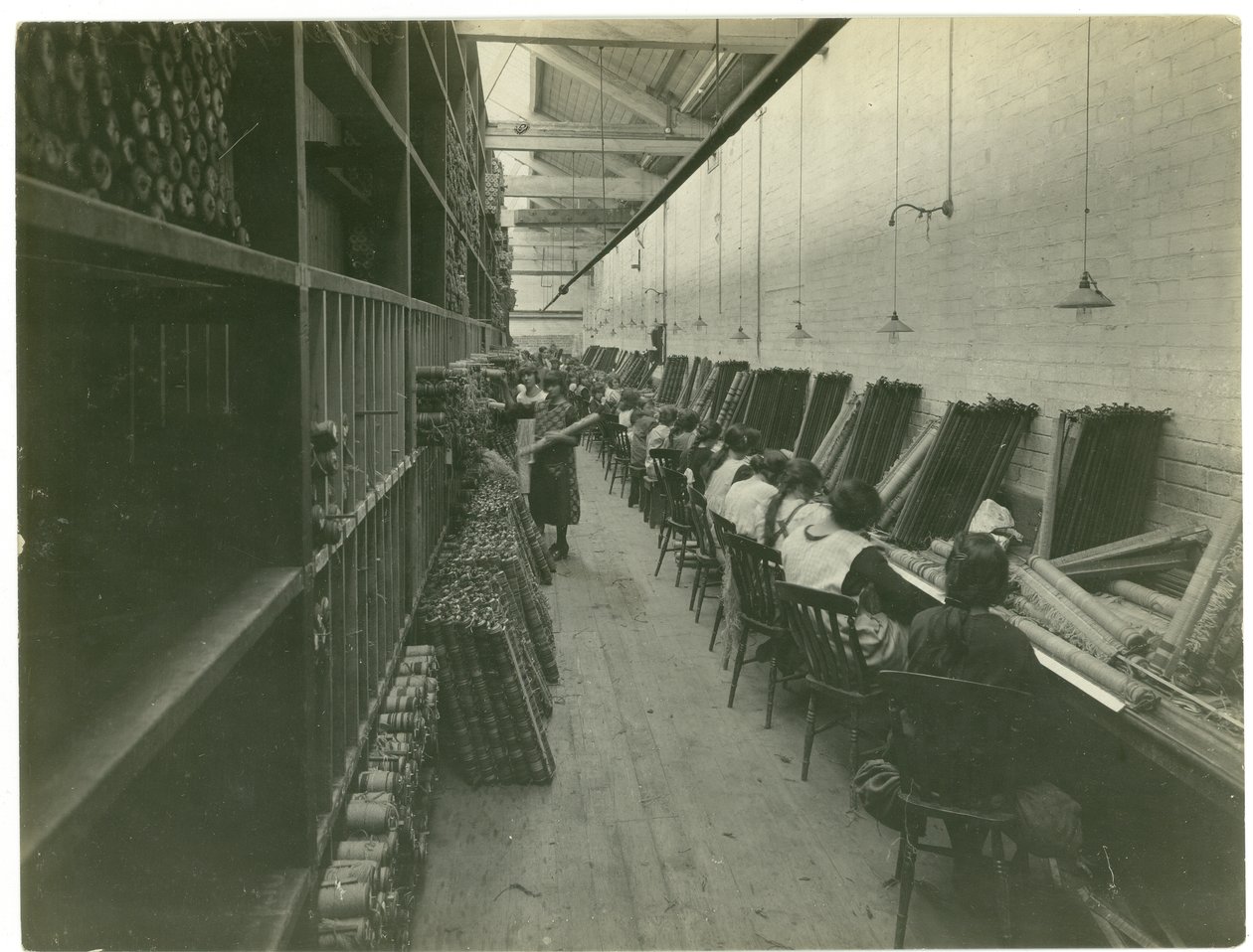 Axminster threading, carpet factory, 1923 by English Photographer