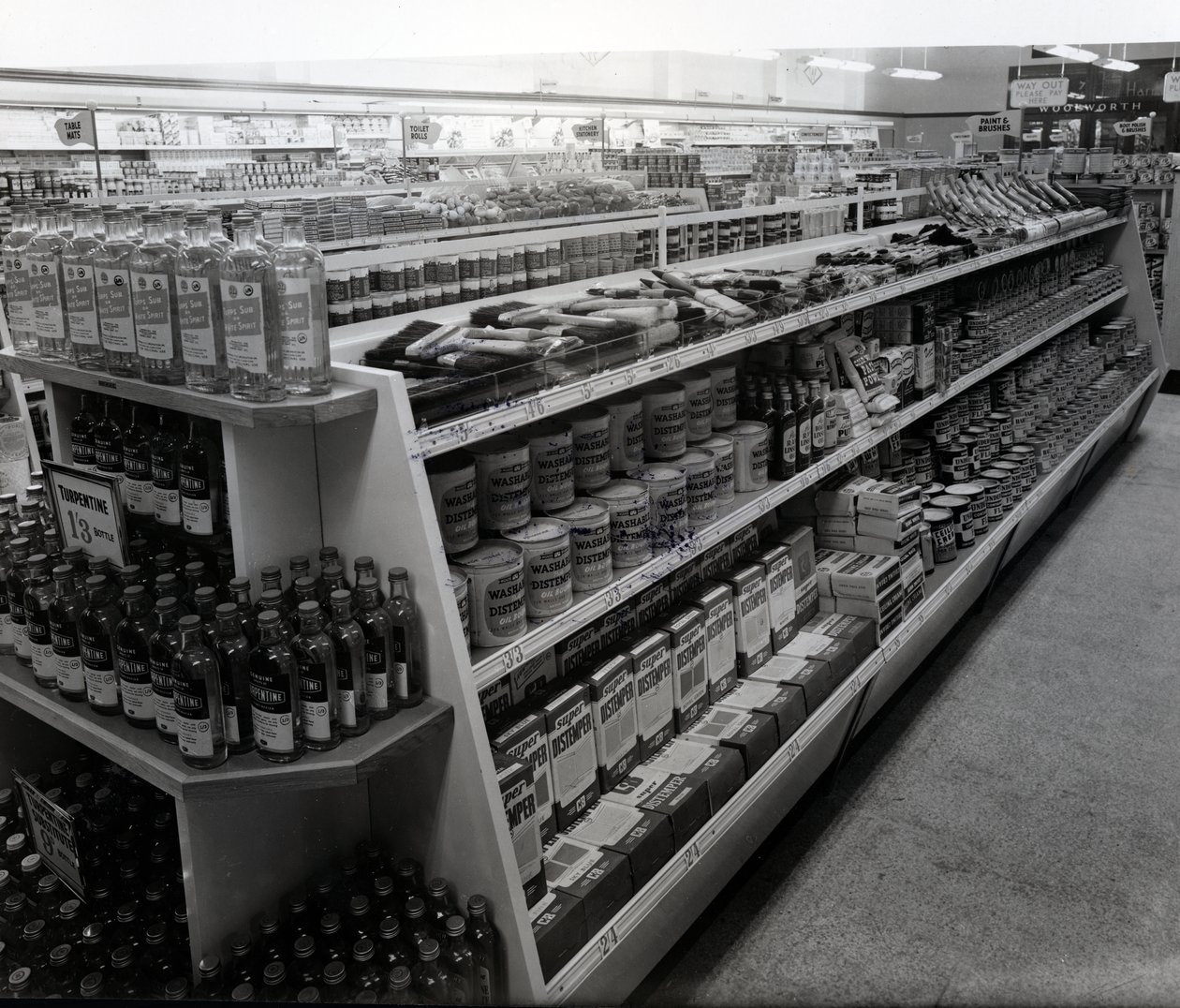 Paint and brushes aisle, Woolworths store, 1956 by English Photographer
