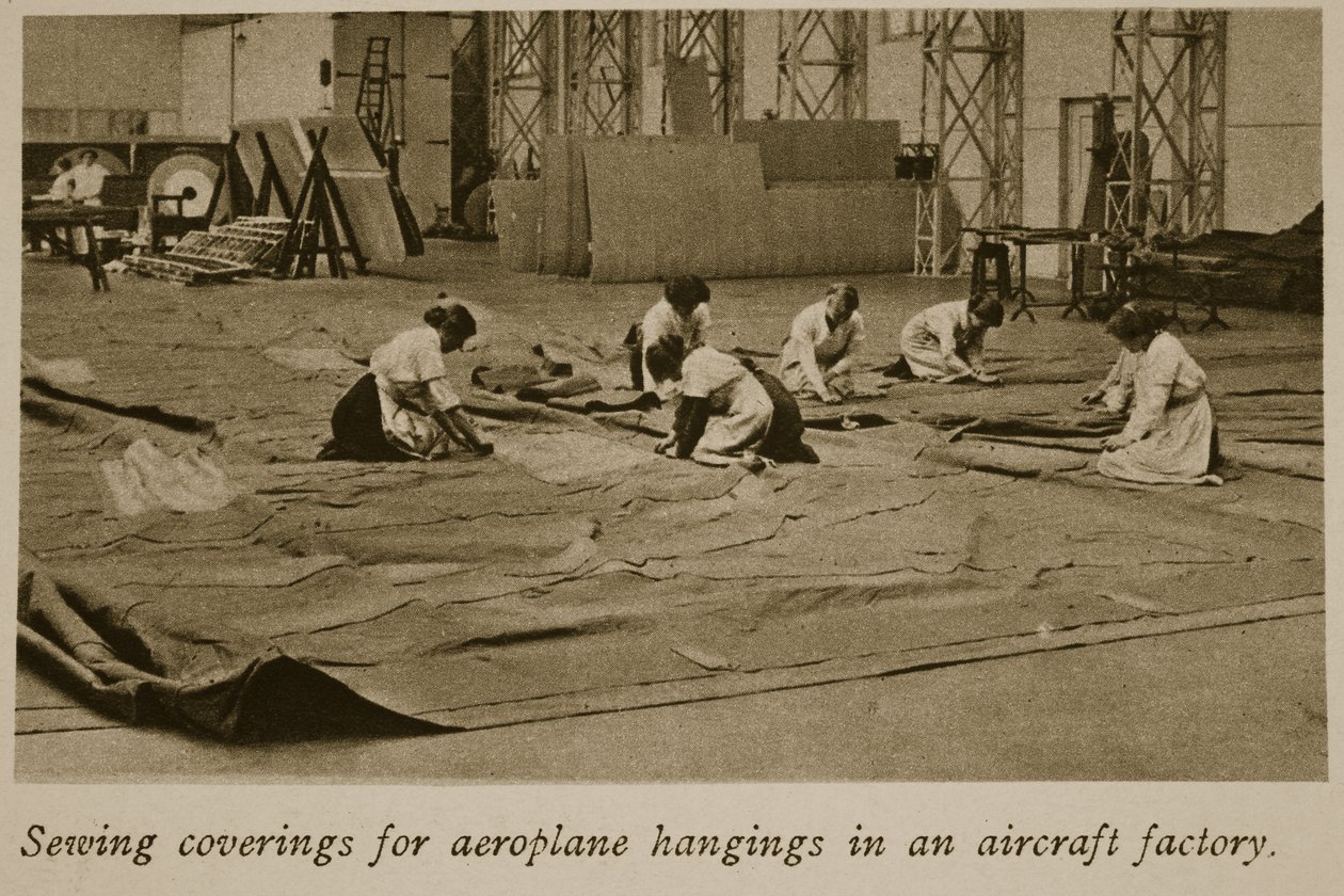 Sewing coverings for aeroplane hangings in an aircraft factory by English Photographer
