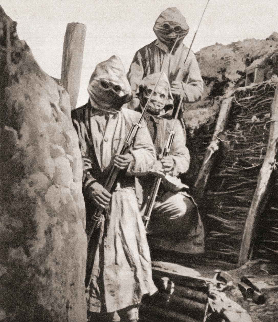 French Infantrymen During WWI Wearing Respirators to Protect Them Against German Poison Gas, from The Illustrated War News, 1915 by English Photographer