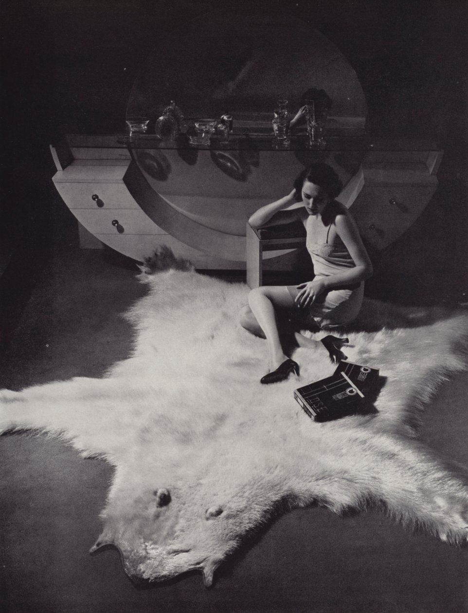 Woman Sitting on a Bearskin Rug by English Photographer