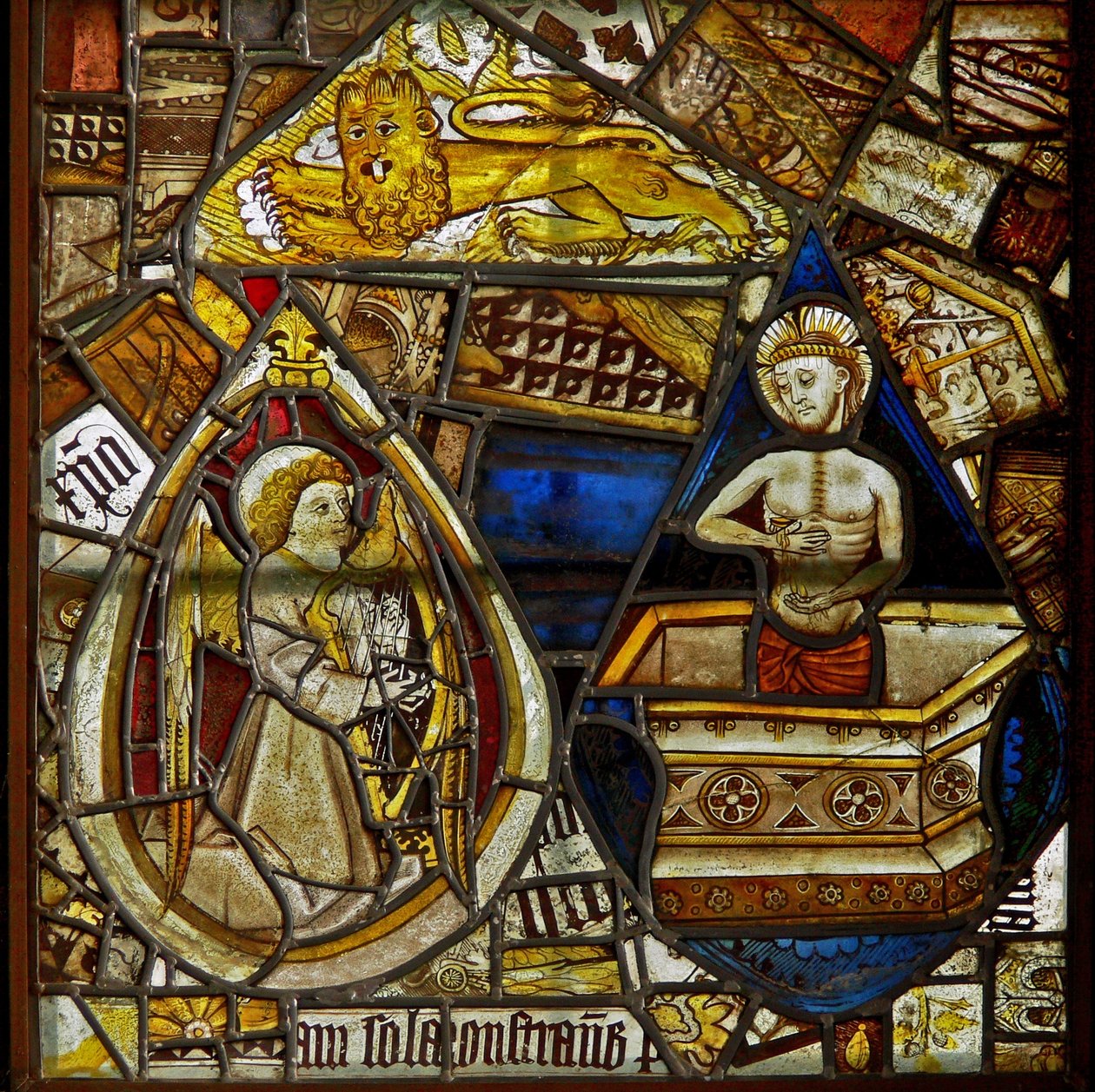 A panel in the east window depicting Christ of Pity rising from the tomb, a musician angel with a harp, and St Mark