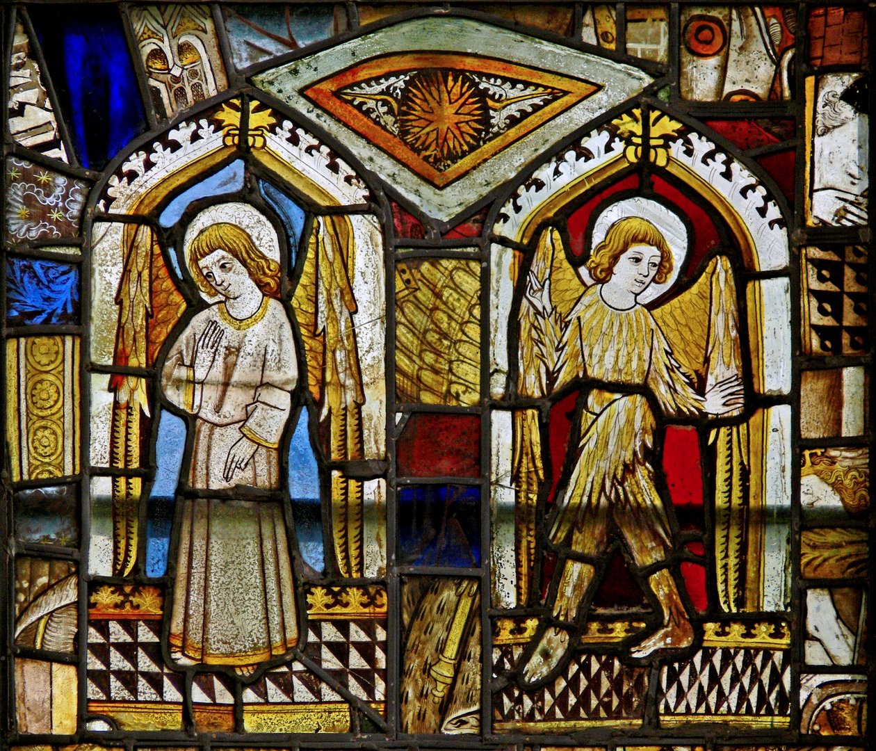 A panel in the east window depicting angels, one feathered by English School