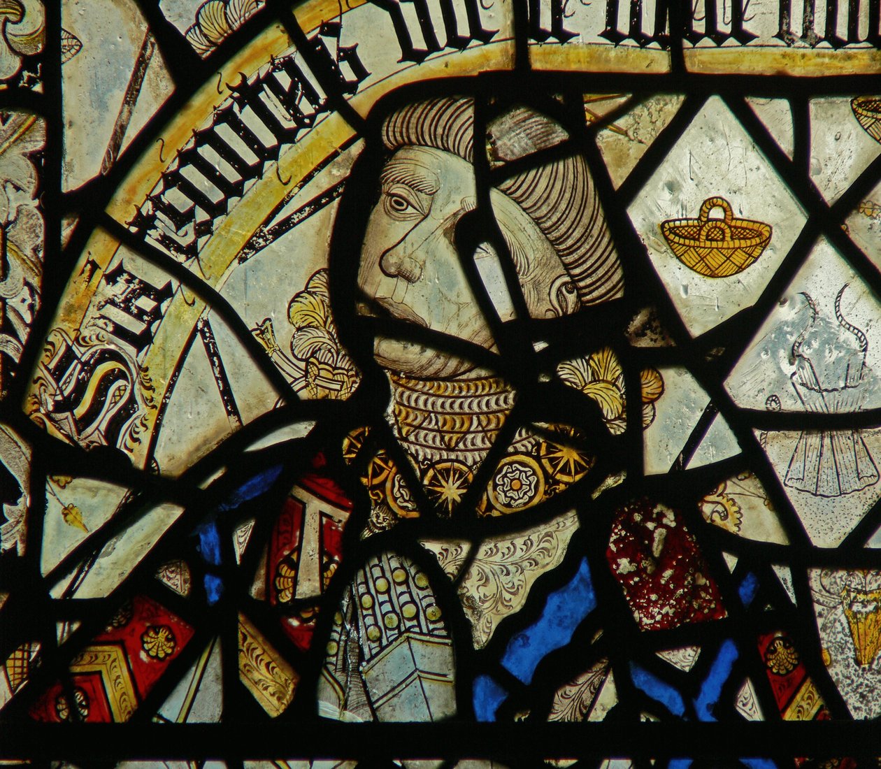 Detail from a window depicting the donor (detail) by English School