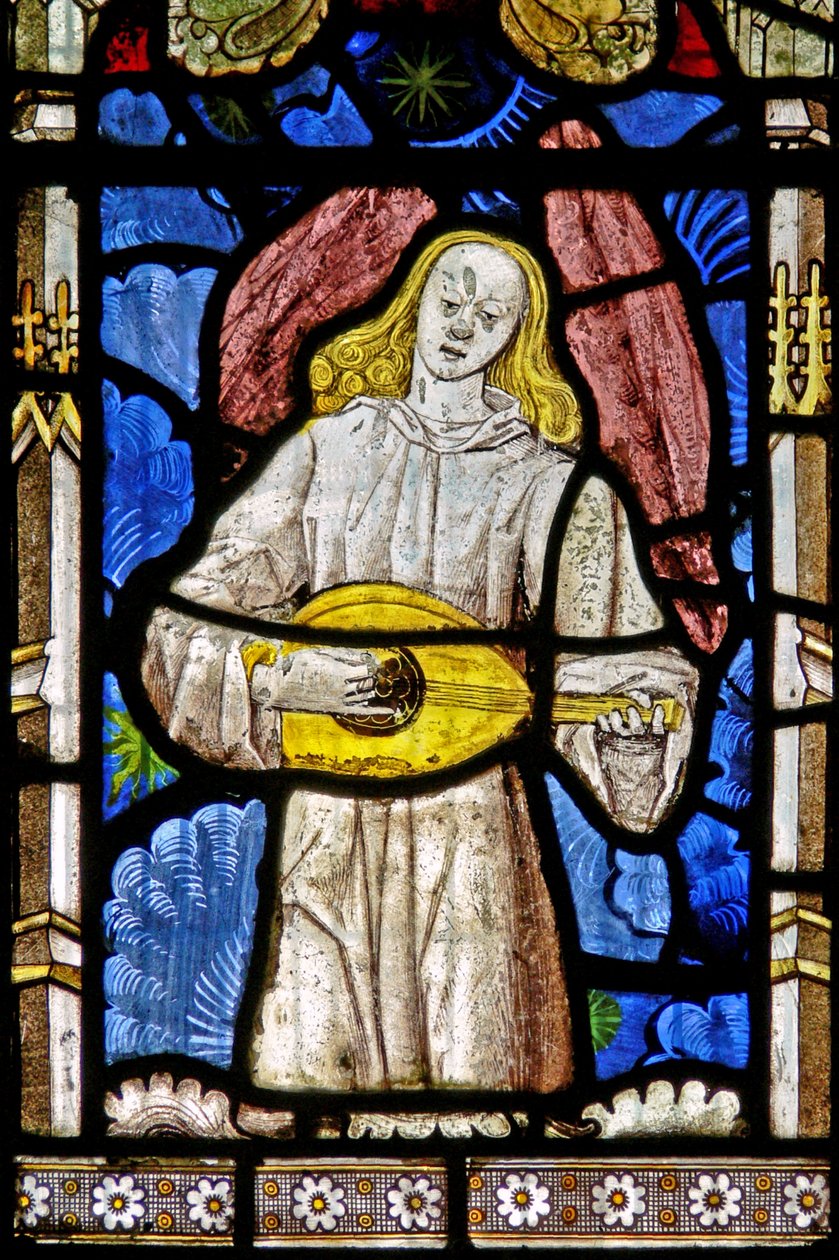 The East window depicting a musician angel with lute by English School