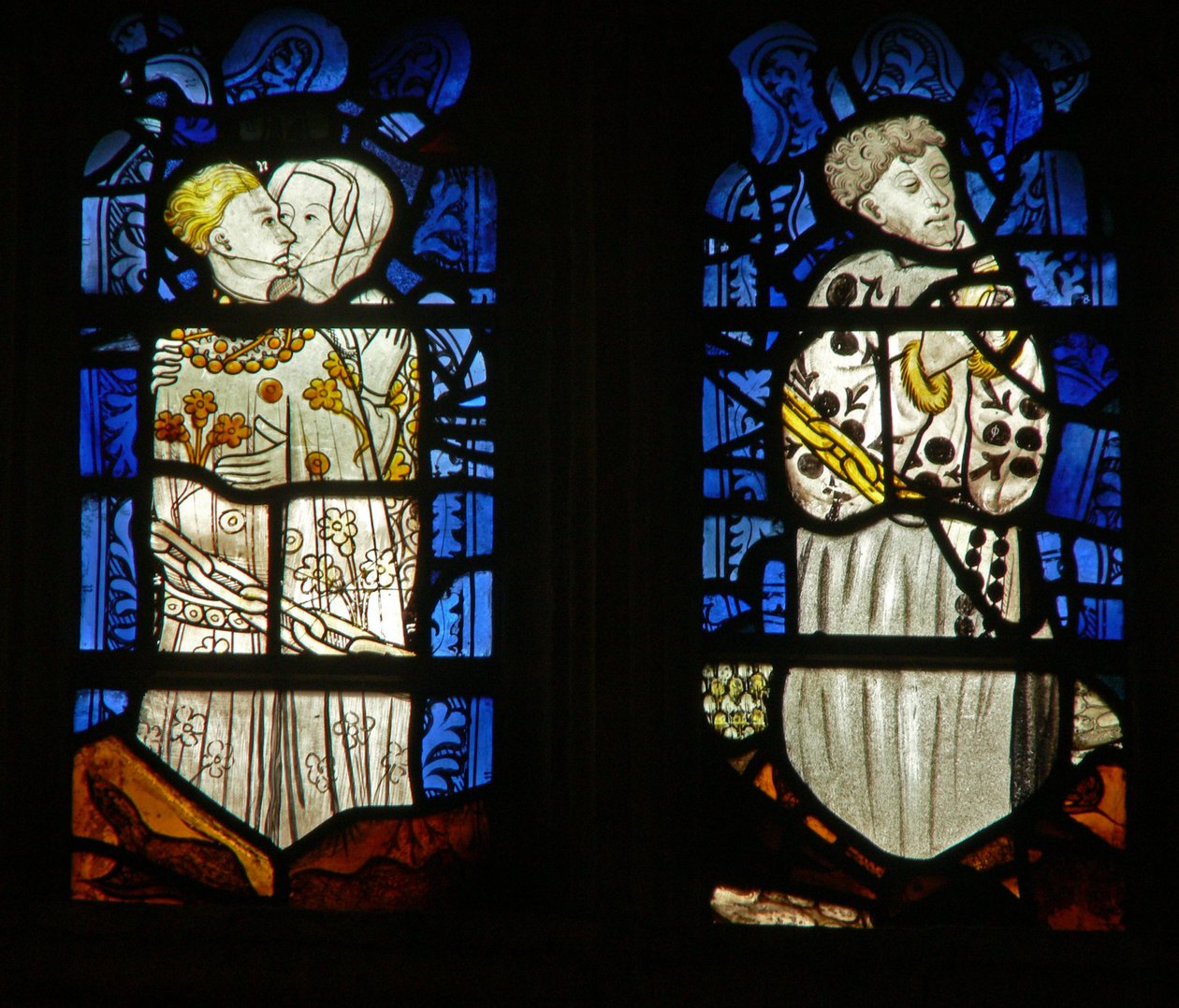 The east window depicting the Seven Deadly Sins: Lust and Sloth by English School