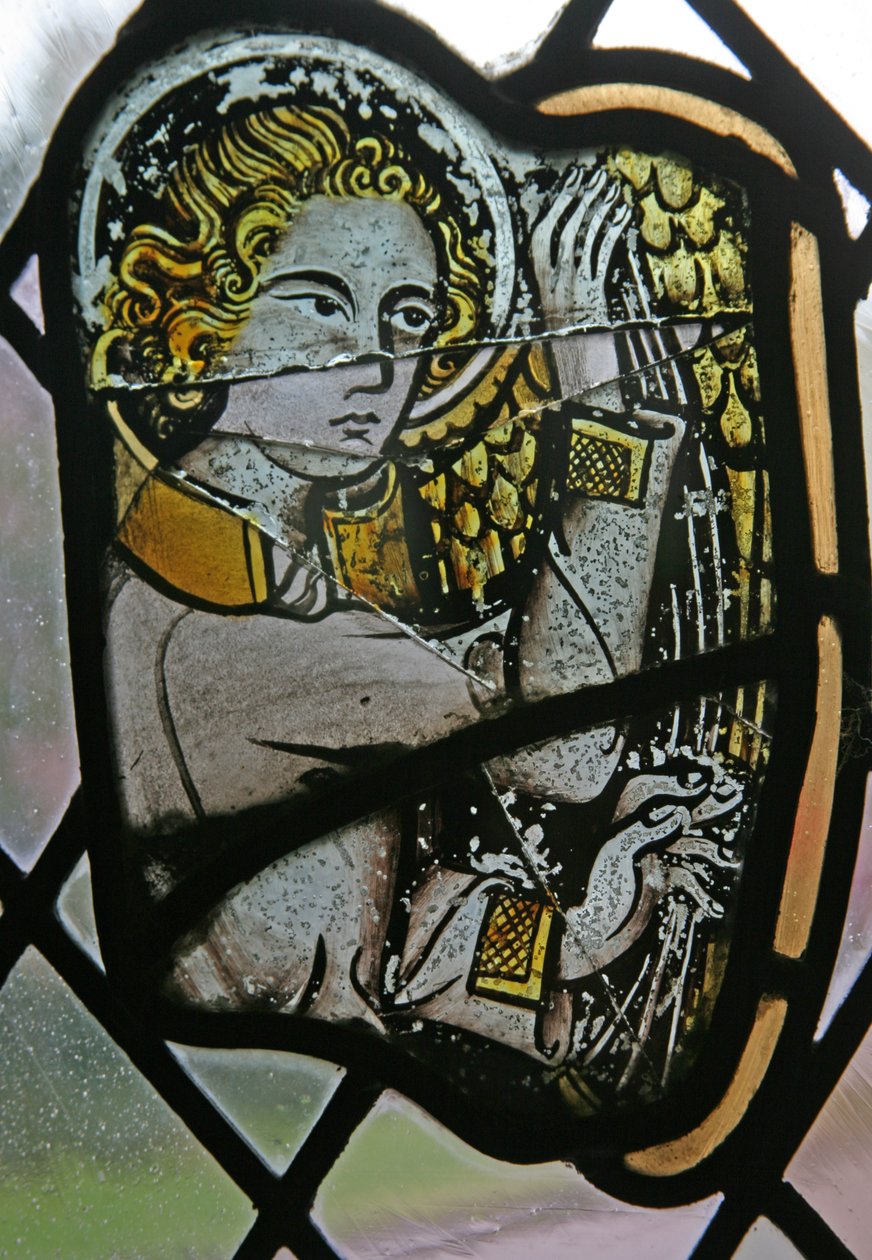 Window in the Cloisters depicting a musician angel with a harp by English School