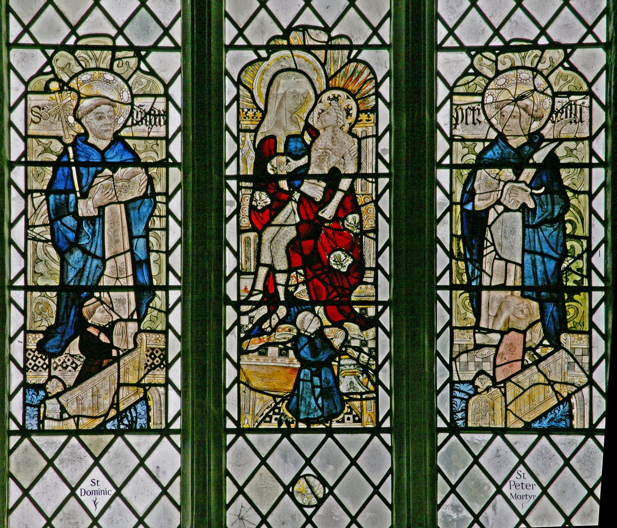 Window w4 depicting the Pieta with St Dominic and St Peter Martyr: small donor figures by English School