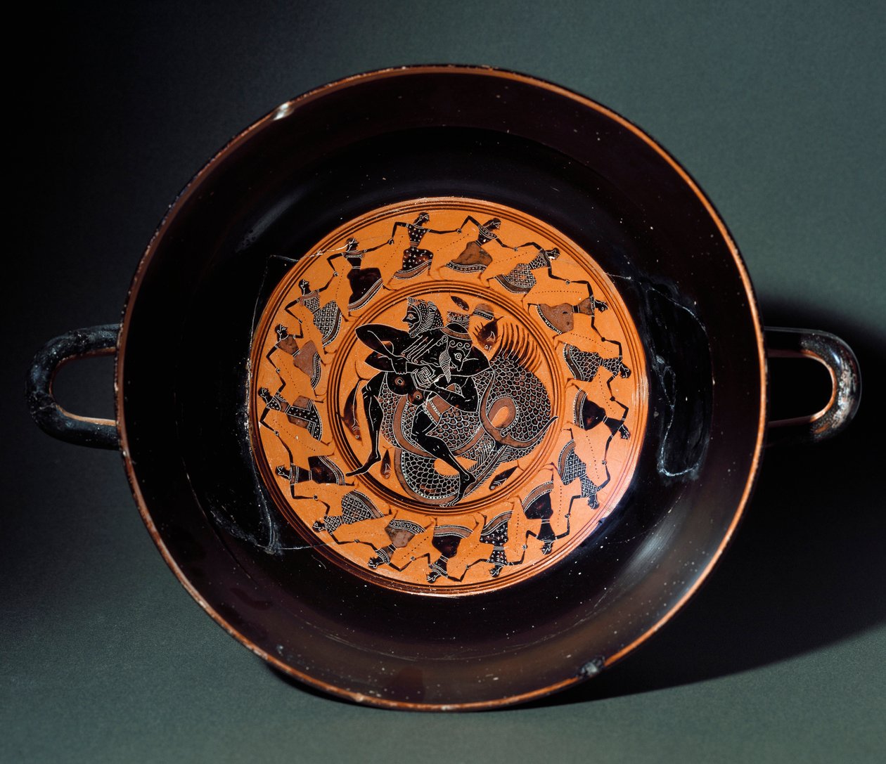 Etruscan antiquity: terracotta cup representing the fight between Heracles and the marine monster Triton. From Tarquinia by Etruscan