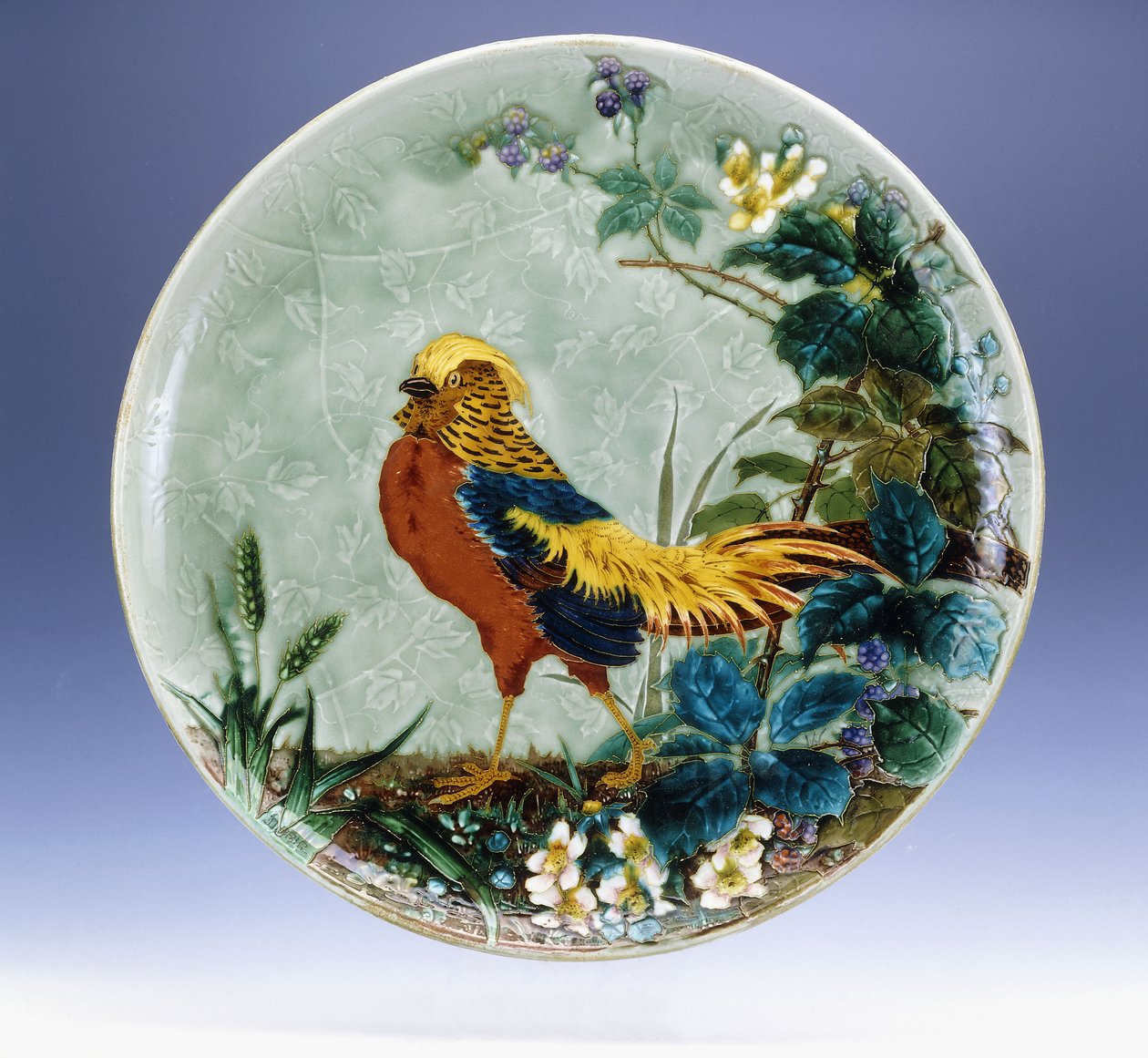 A large Emile Diffloth glazed earthenware charger, depicting a Golden Pheasant by Eugène Carrière