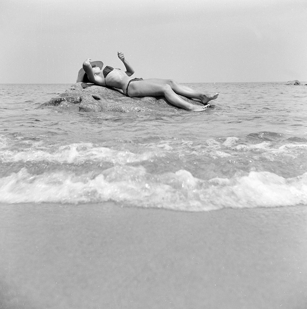 Girl Sunbathing on a Rock in Cefalù by Fosco Maraini
