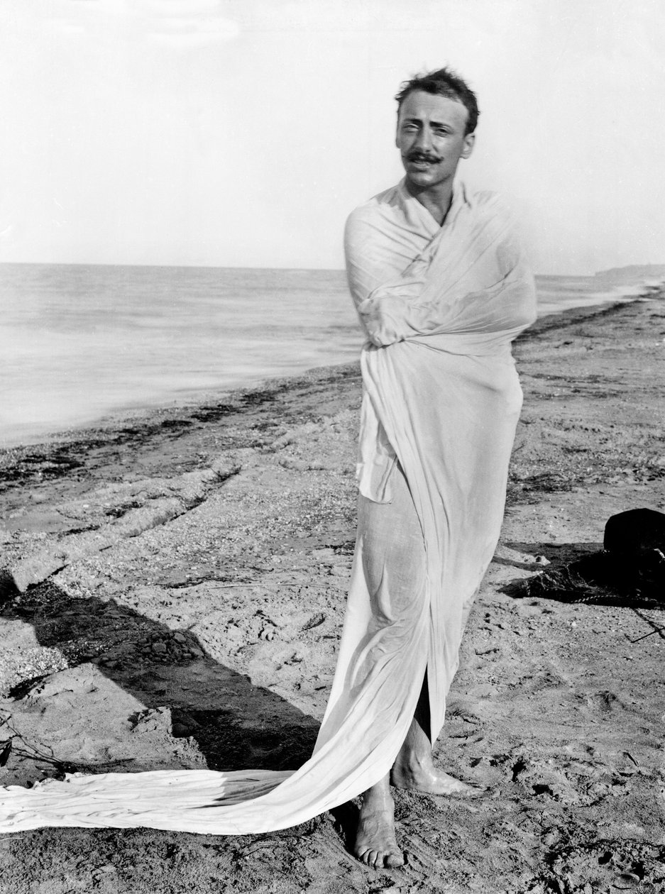 Gabriele D'Annunzio wearing a dressing-gown on the beach in Francavilla