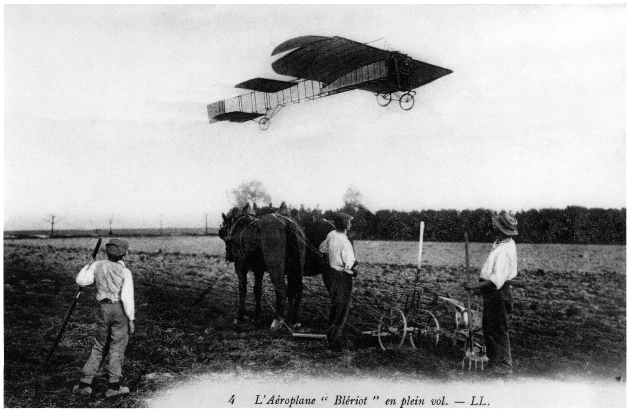 Louis Bleriot flying in his aeroplane by French Photographer