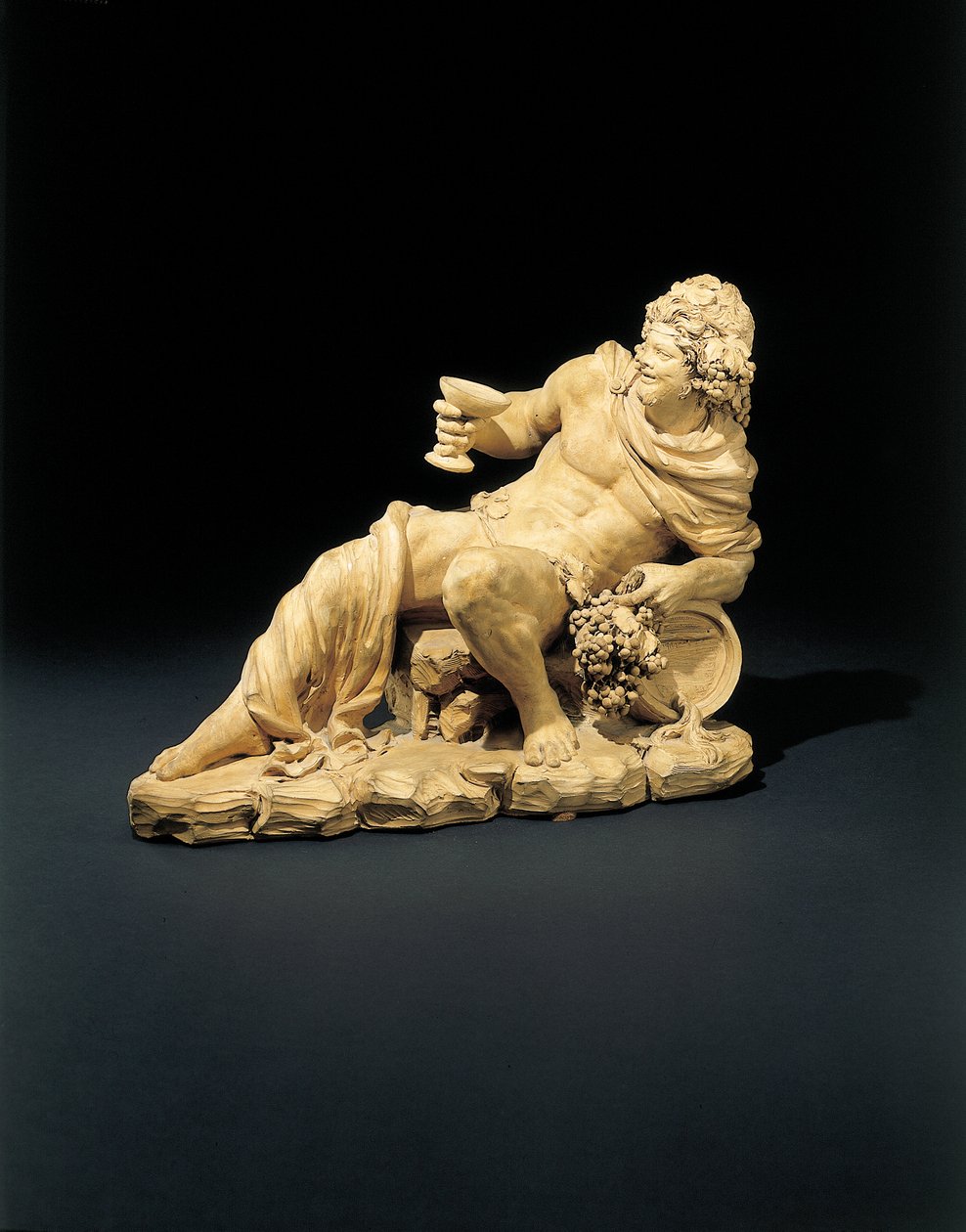 Figure of Bacchus Reclining with a Glass of Wine by French School