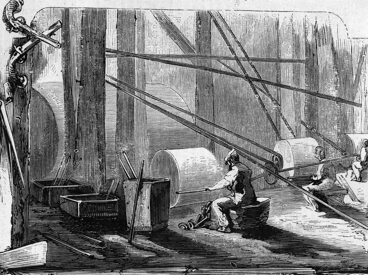 Manufacture of rifle guns: polishing iron cylinders with stone wheels. Engraving in 