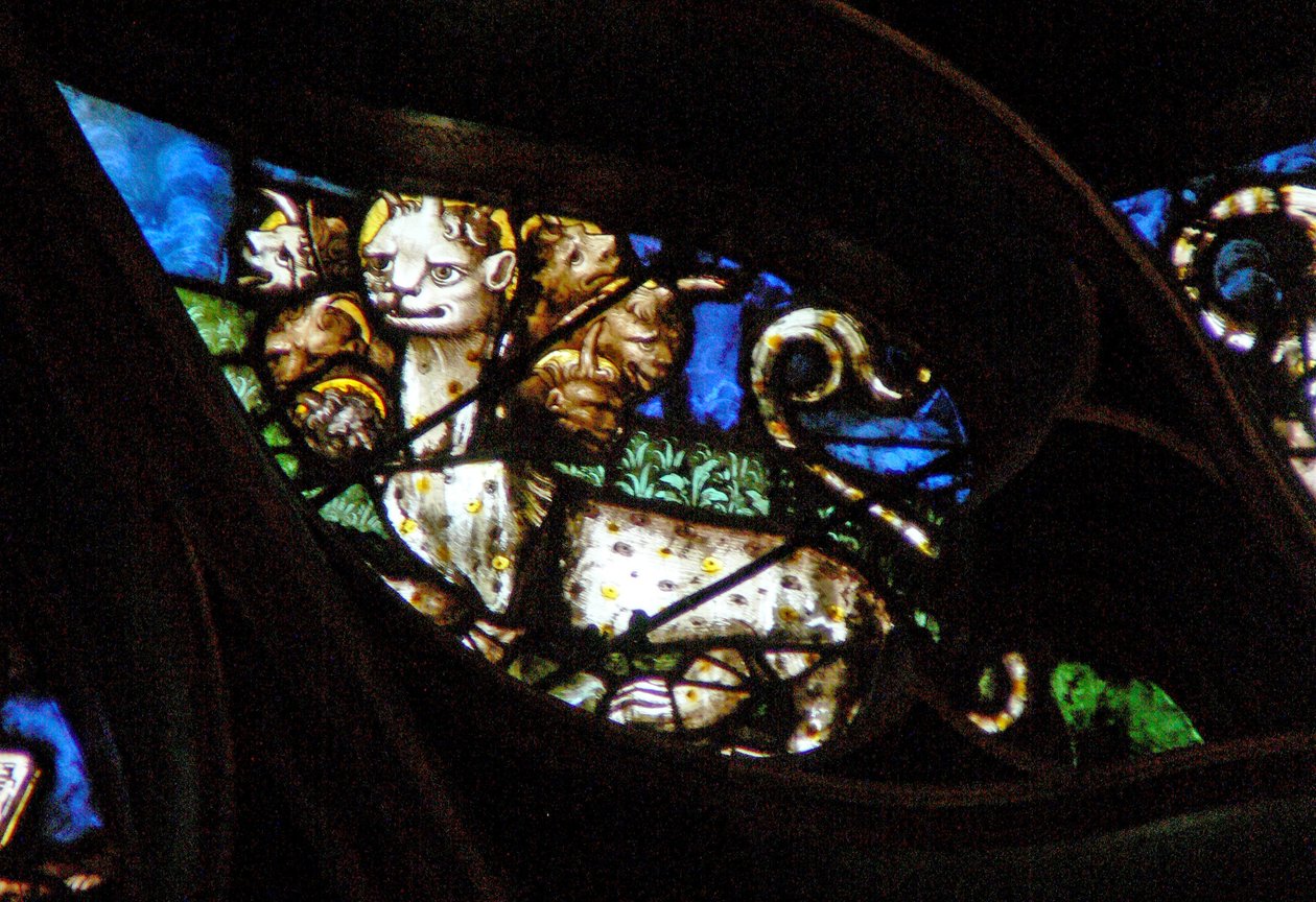 The west rose window depicting a scene from the Book of Revelation: Beast with seven heads comes out of the sea by French School