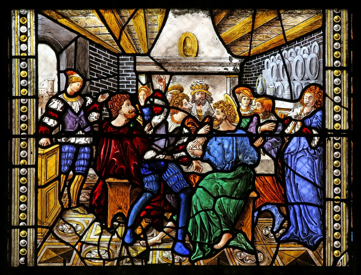 Window depicting St Thomas in India is invited to the wedding of Pelagius, is beaten by a servant who is in turn eaten by a lion. A dog brings in the servant