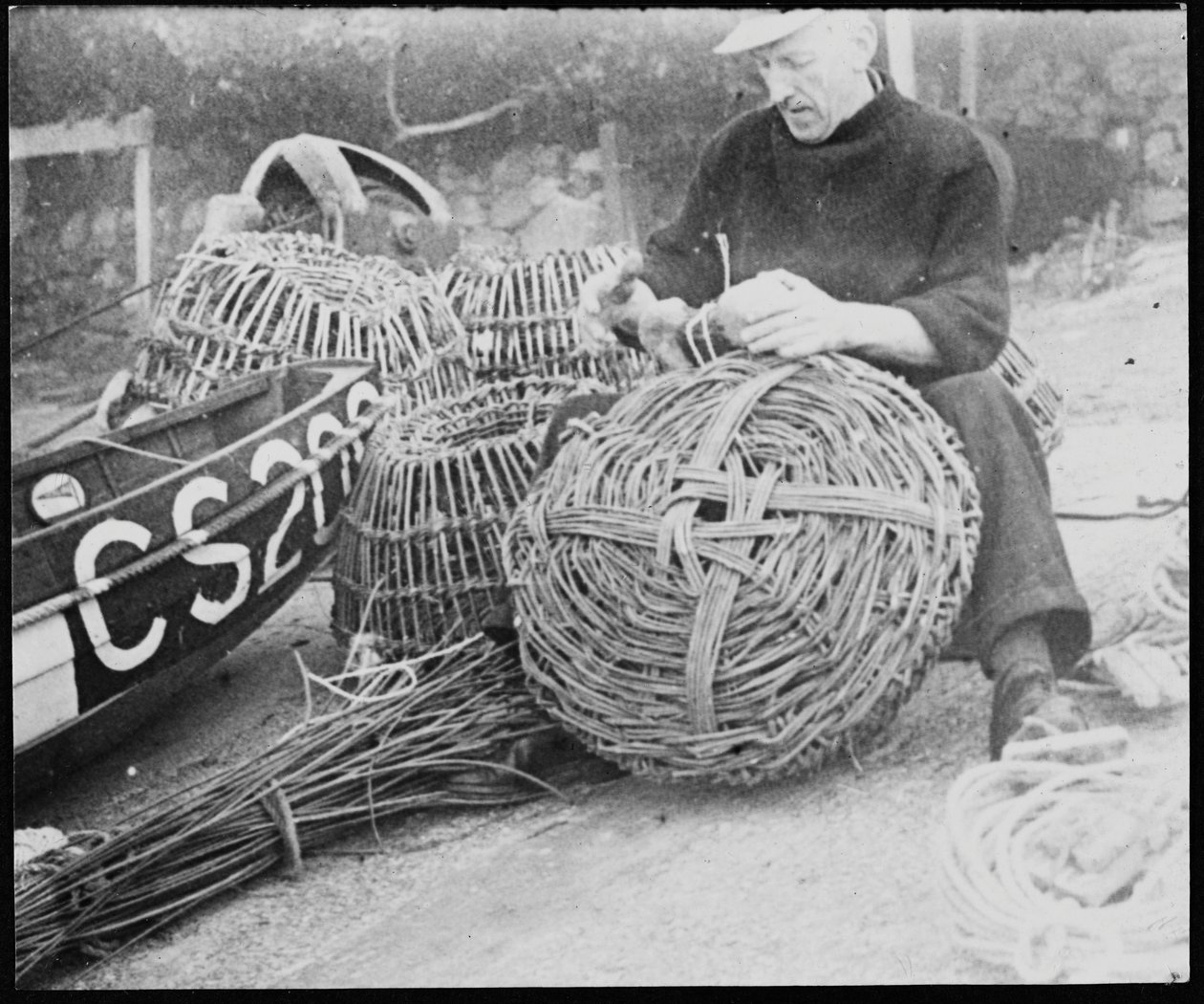 A fisherman making lobster pots at Steephill Cove by George R. Long