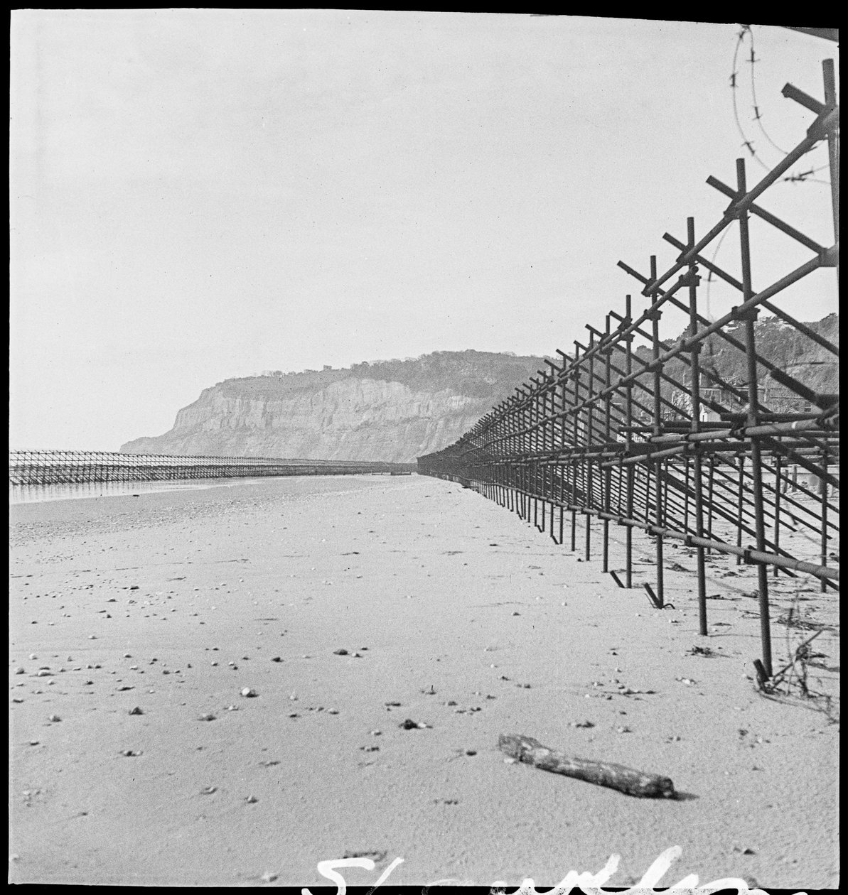 The beach at Shanklin, showing two rows of Admiralty scaffolding by George R. Long
