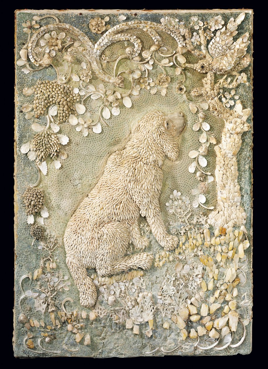 One of a pair of Louis XV seated dogs modelled in relief, within a grotto-like surround by German School