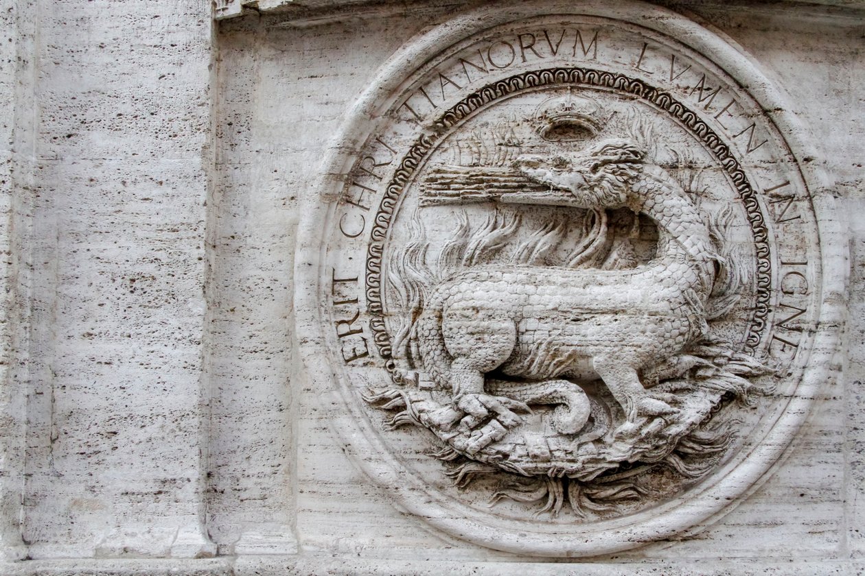 Coat of arms on facade of St Louis of French church by Giacomo della Porta