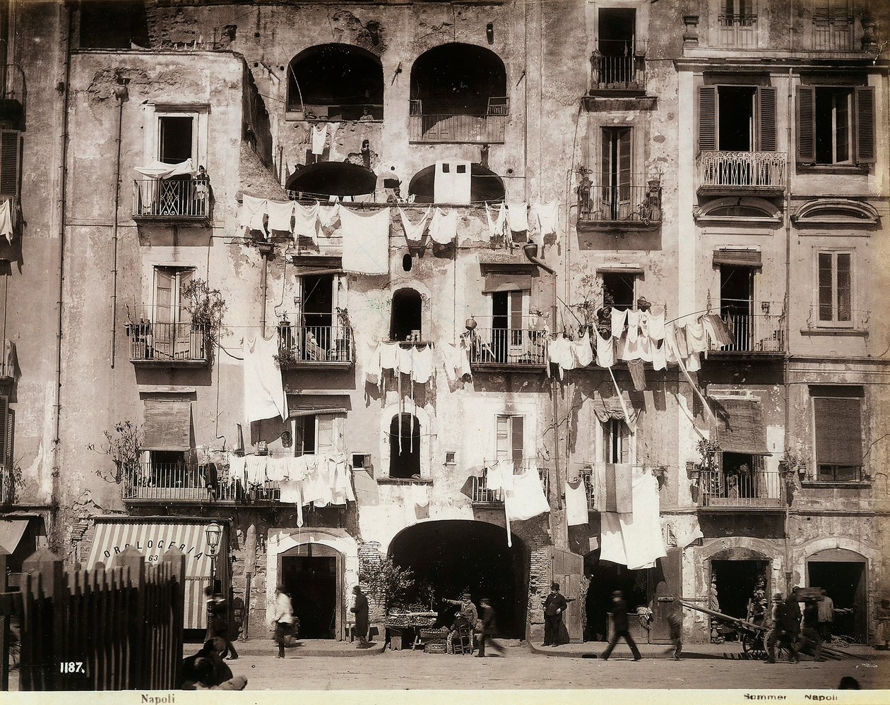 Façade of a building with laundry hanging out to dry, Naples by Giorgio Sommer