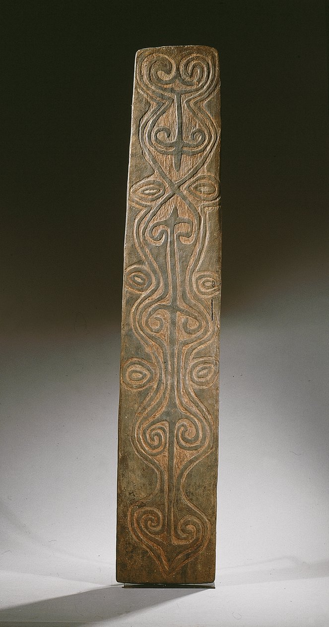 Rectangular New Guinea shield, decorated with carved scrolls in relief, the back with six carved lugs to hold rattan loops, April River by Guinean New