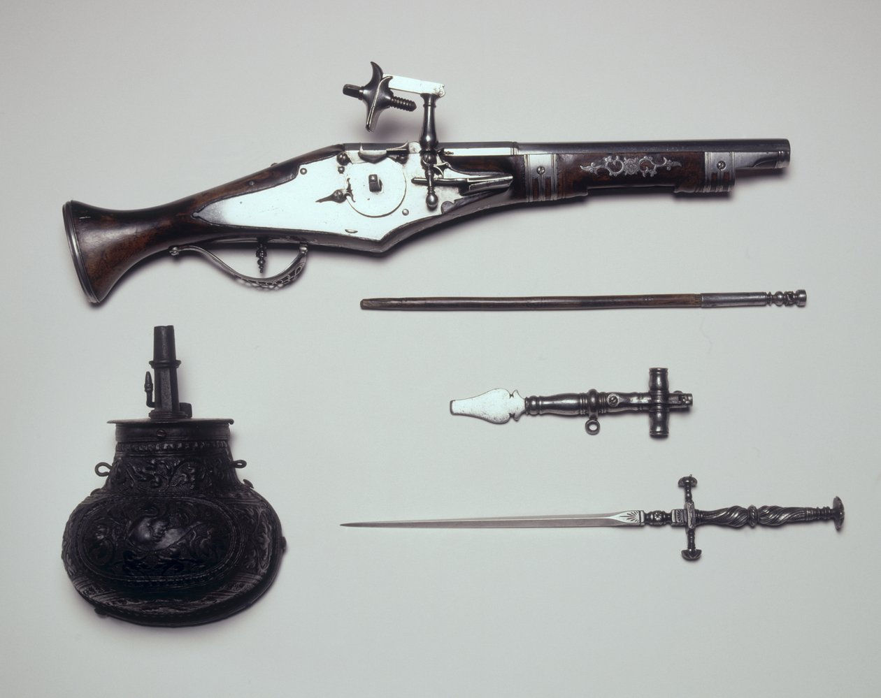 Group of Weapons: Wheellock Pistol, Winding Key, Powder Flask and Stiletto by Italian School