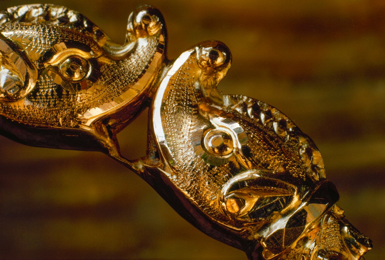 Hand crafted gold bracelet featuring two shark heads colliding by James L Stanfield