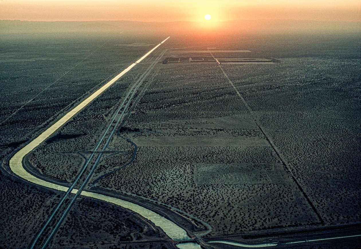 Aerial view of the All-American Canal as the blazing sun sets in the west by James L Stanfield