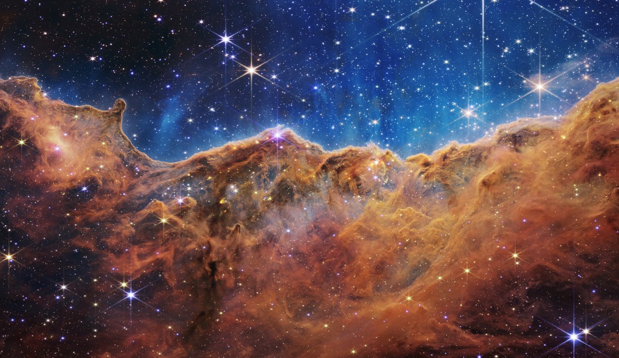 Cosmic Cliffs in the Carina Nebula by James Webb Space Telescope (NASA)