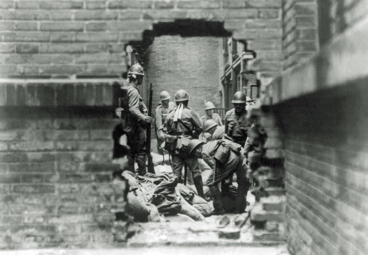Japanese soldiers are involved in street fighting in Shanghai, China by Japanese Photographer