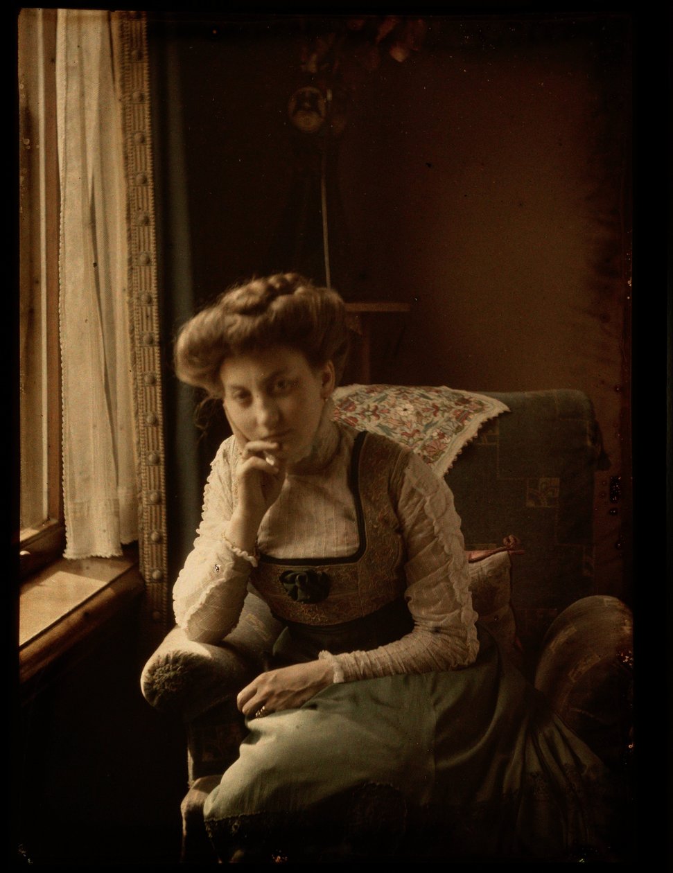 Woman sitting by the window by Johannes Hendrikus Antonius Maria Lutz