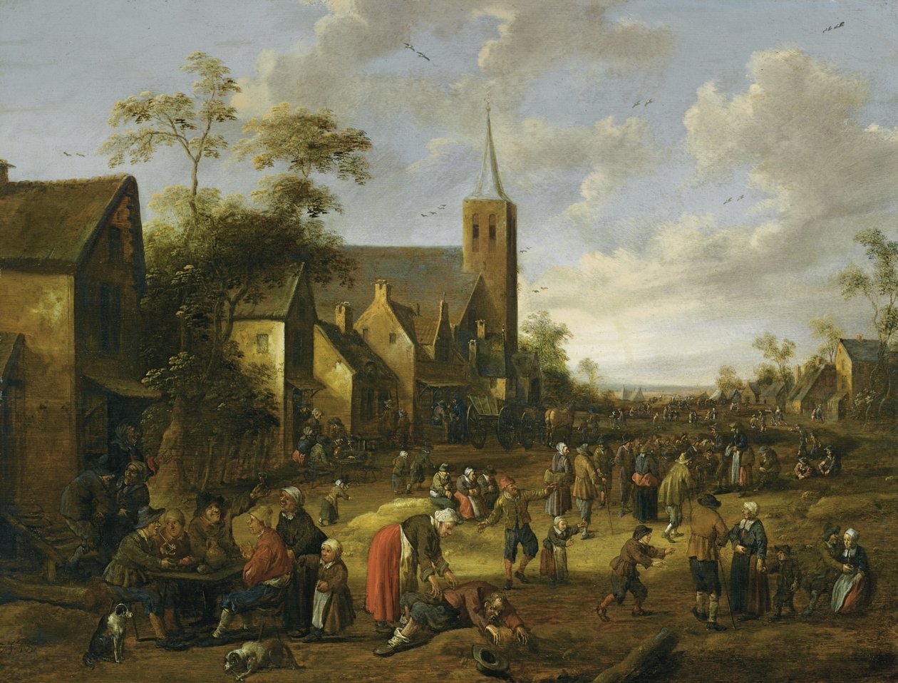 A Busy Village Street with Numerous Figures, Peasants Eating and Drinking at a Table in Foreground, a Church Tower Beyond by Joost Cornelisz Droochsloot