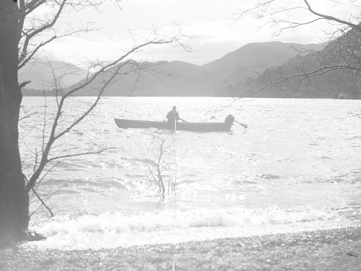 A man fishing in a boat on a lake, hills in background by Joseph Hardman