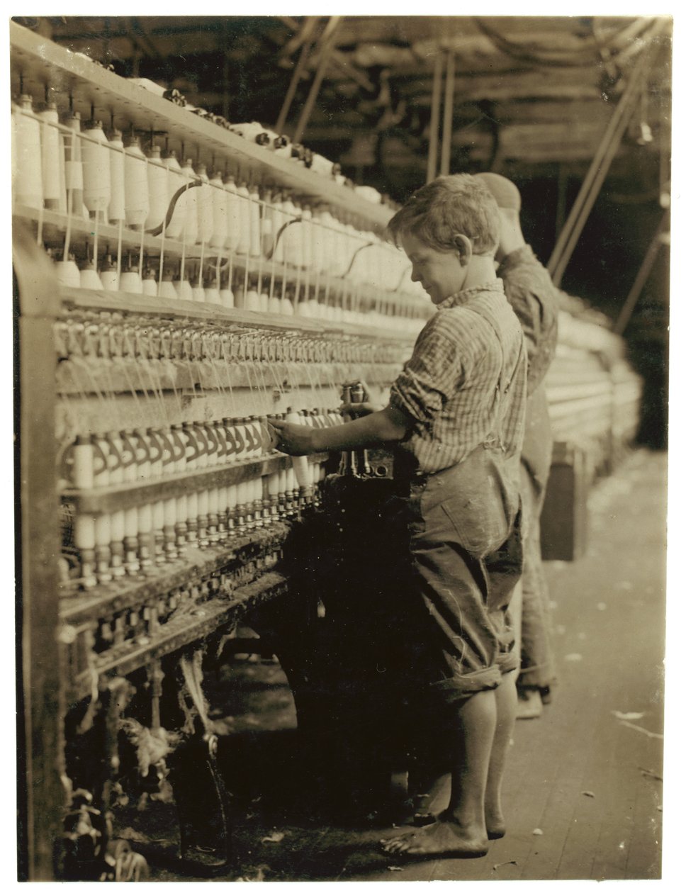 Young Doffers Replacing Full Bobbins at North Pownal, Vermont by Lewis Wickes Hine