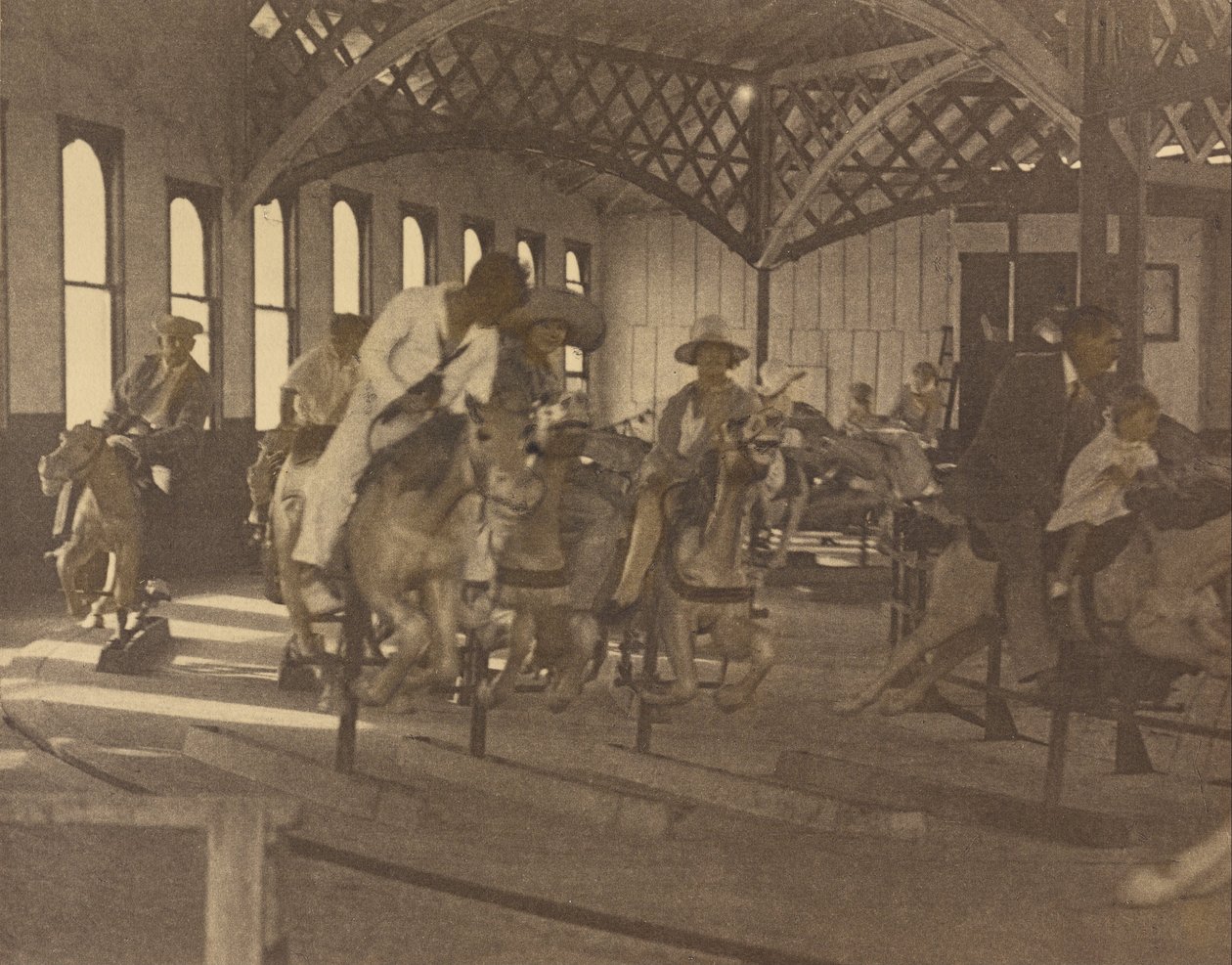 People Riding on a Carousel by Louis Fleckenstein