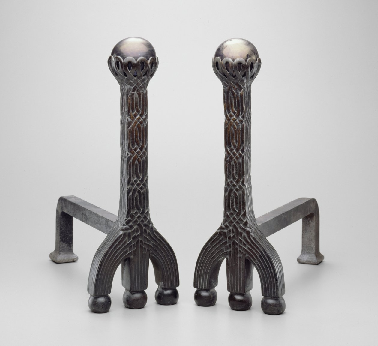 Pair of andirons by Louis Comfort Tiffany