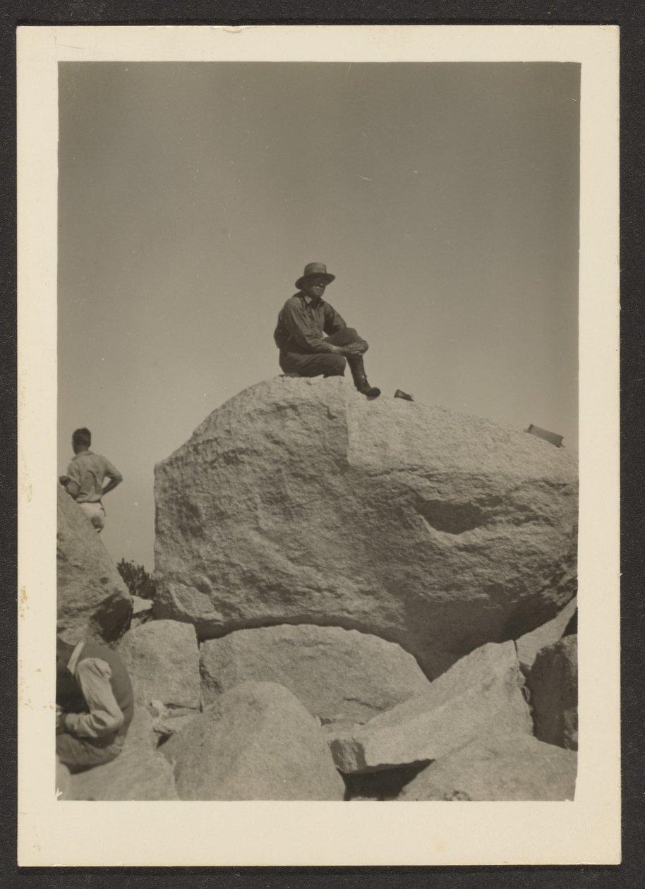 [Man Seated on Rocks] by Louis Fleckenstein