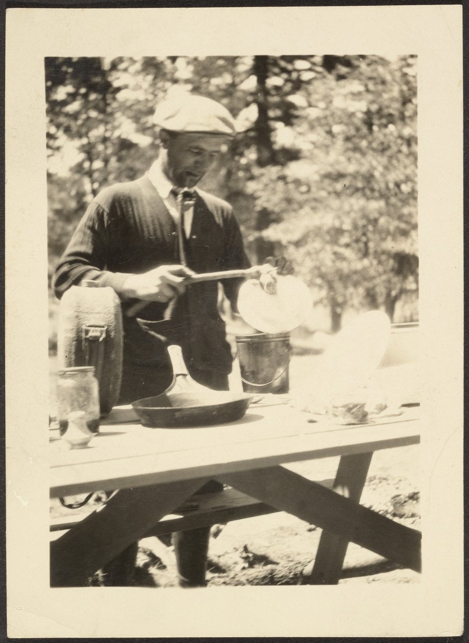 Man Standing at Picnic Table by Louis Fleckenstein