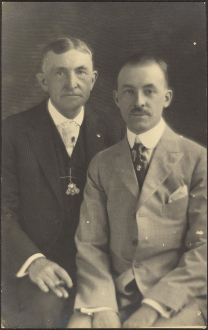 Portrait of Two Men with Suit Accessories by Louis Fleckenstein