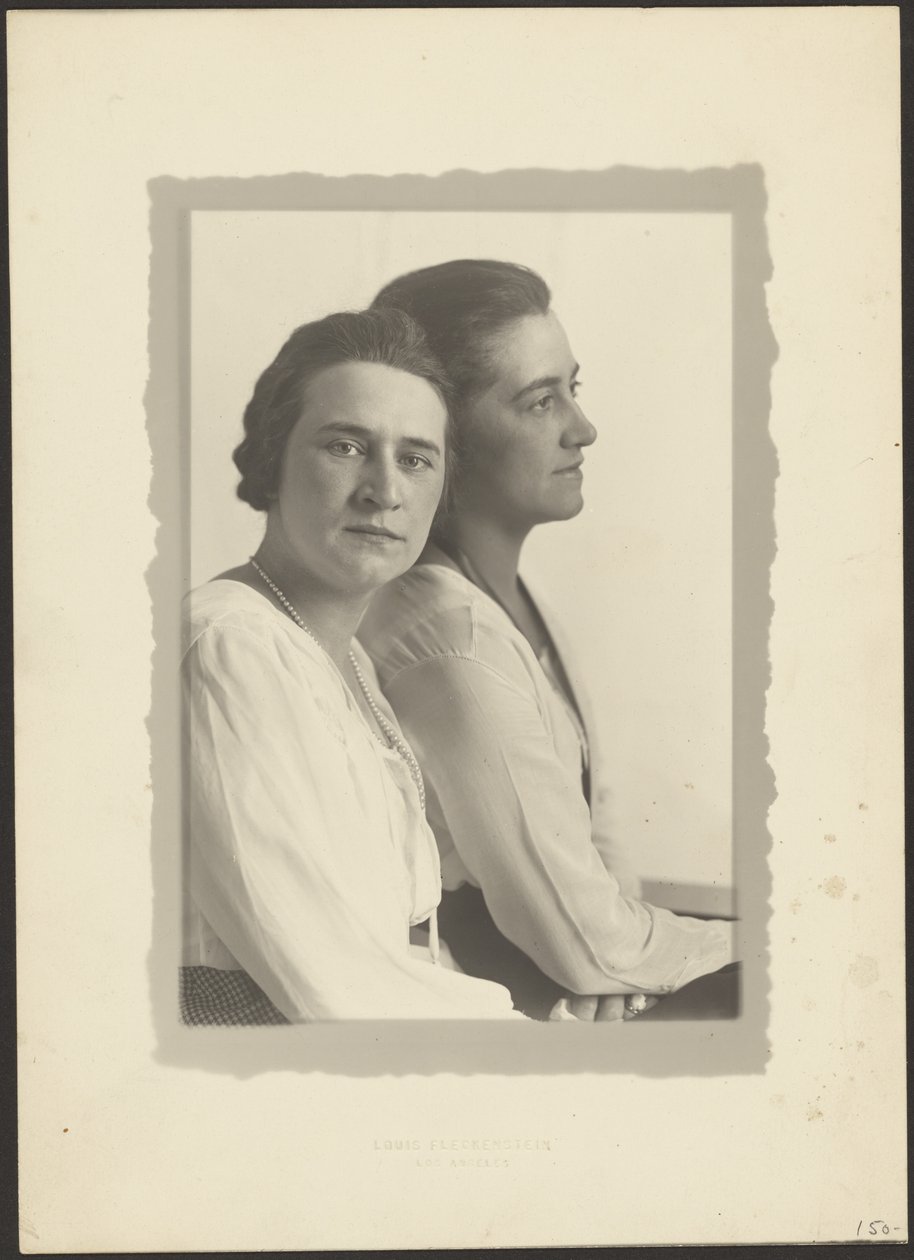 Portrait of Two Women Against White Backdrop by Louis Fleckenstein