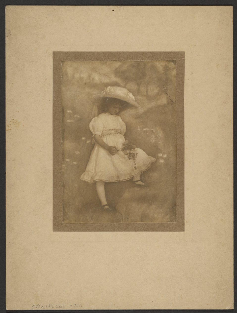 Portrait of a Girl with Flowers Before Painted Backdrop by Louis Fleckenstein