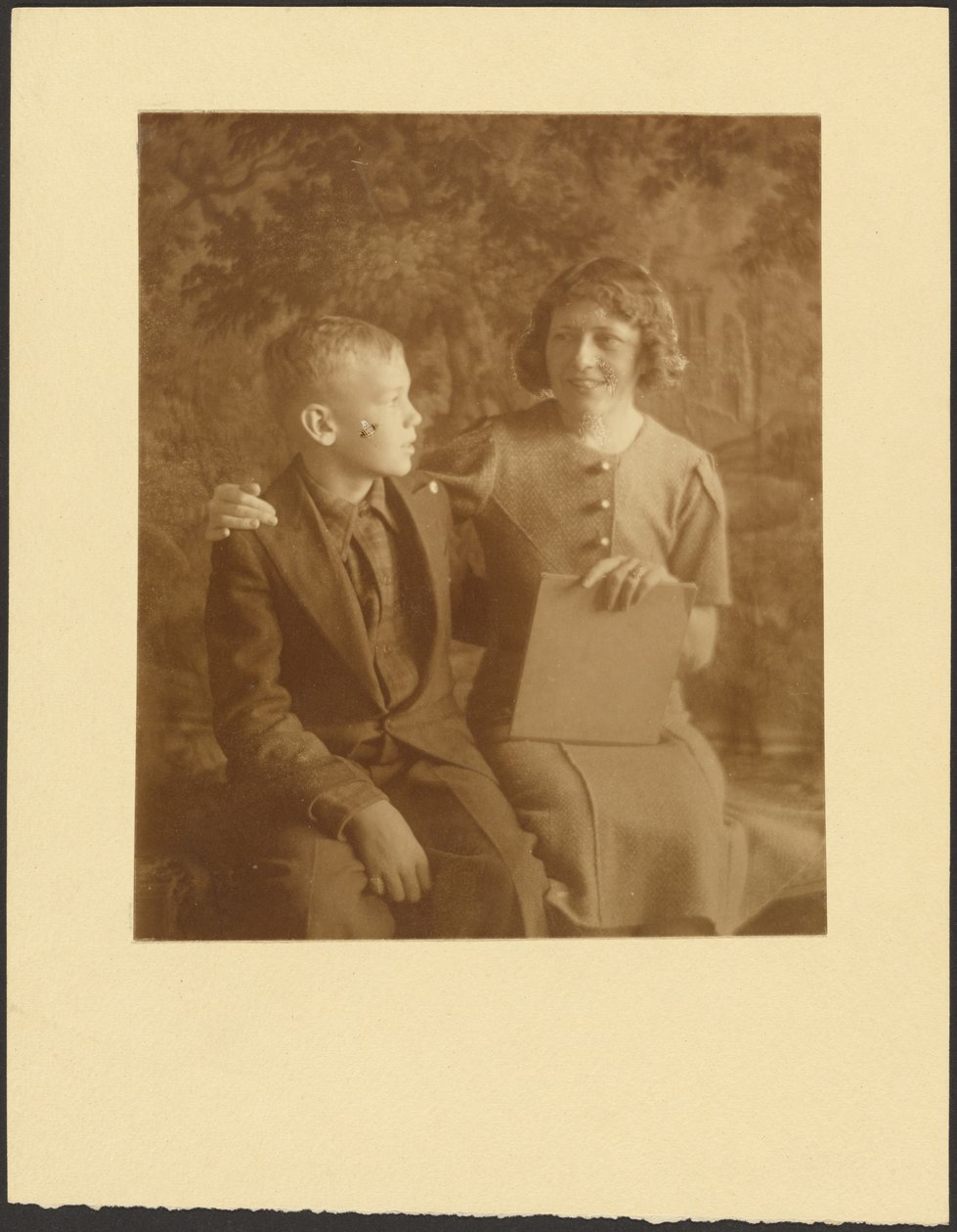 Woman and Young Man Seated Before Tapestry by Louis Fleckenstein