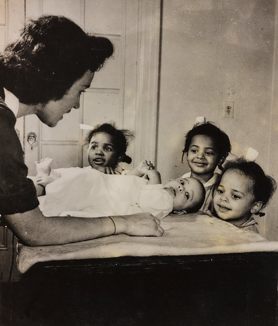 Nurse Henry Street Assists Three African-American Girls in Harlem, New York City by Luigi Leoni