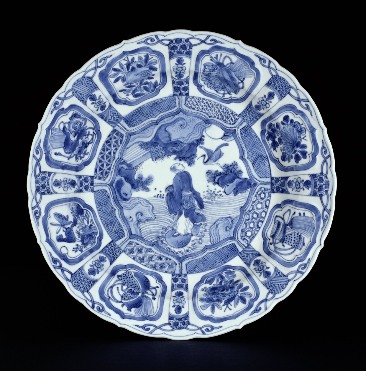 Blue and white kraak platter painted with Li Tiegvai crossing the sea on a double gourd, Wanli period, 1594-1610 by Ming Dynasty Chinese School