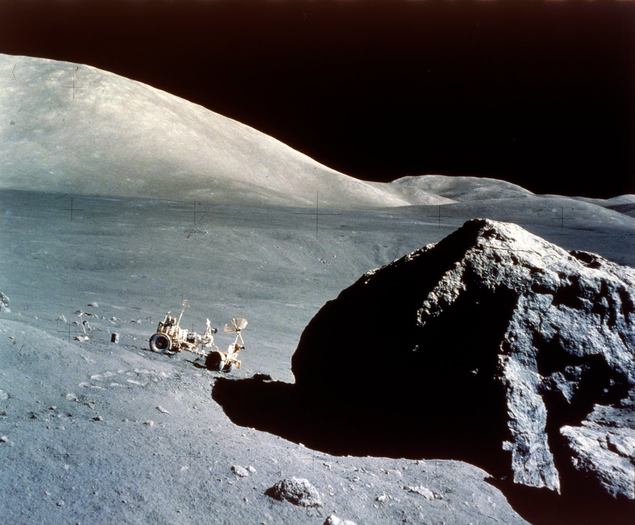 The Rover is dwarfed by a giant rock on the lunar surface, Apollo 17 ...