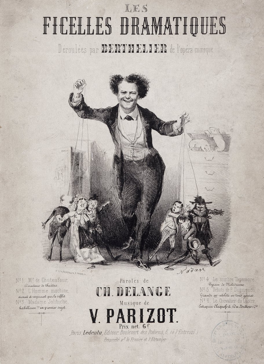 Portrait of Jean Berthelier holding the sons of puppets. Album 