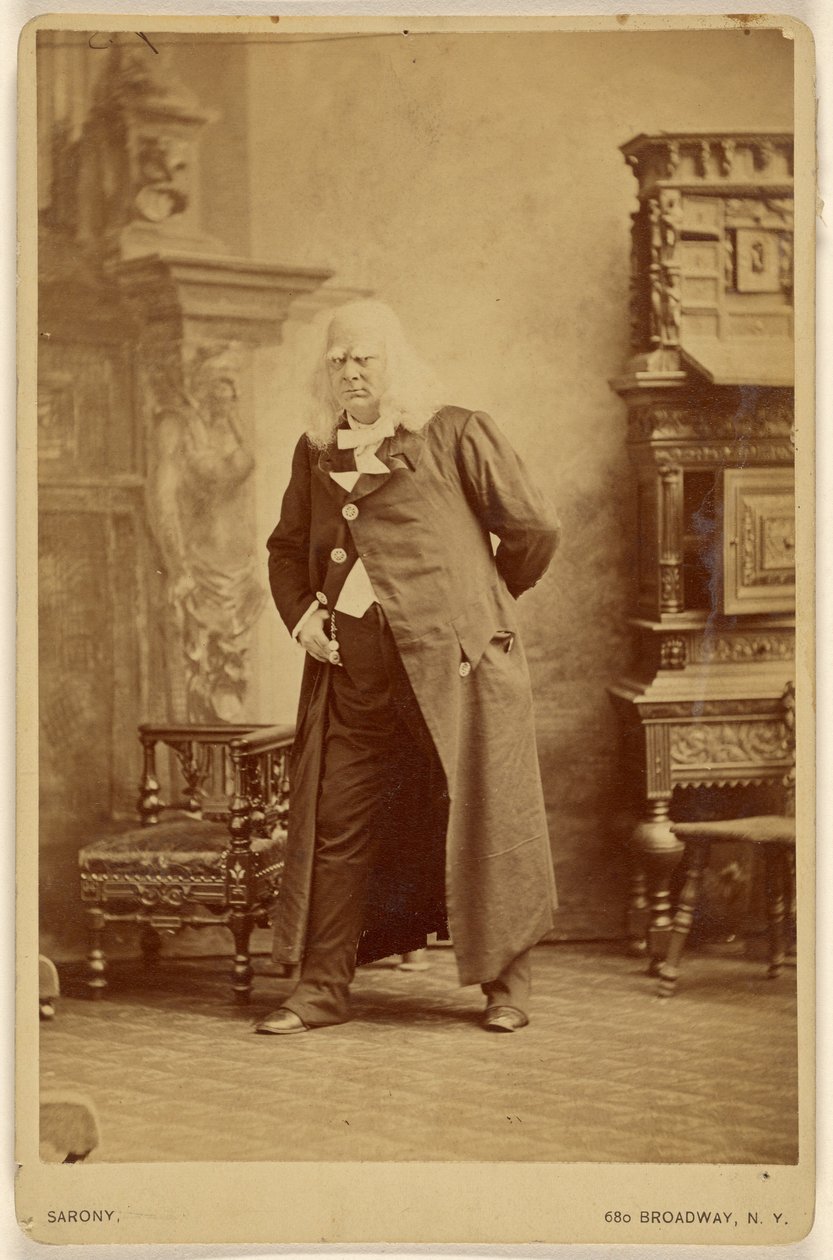 [Actor in long white wig with white bushy eyebrows, standing] by Napoleon Sarony